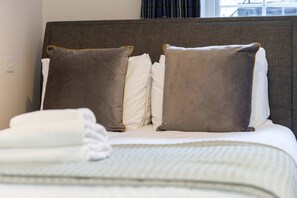Restful retreat with a comfortable bed and a window above.