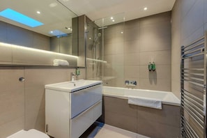 Bathtub, hair dryer, towels