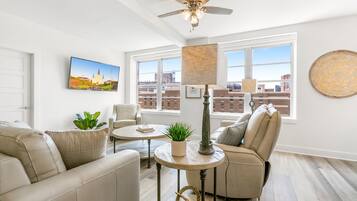 Luxury Condo, 4 Bedrooms | Living room | 55-inch flat-screen TV with satellite channels, TV, Netflix