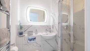 Bathtub, hair dryer, towels