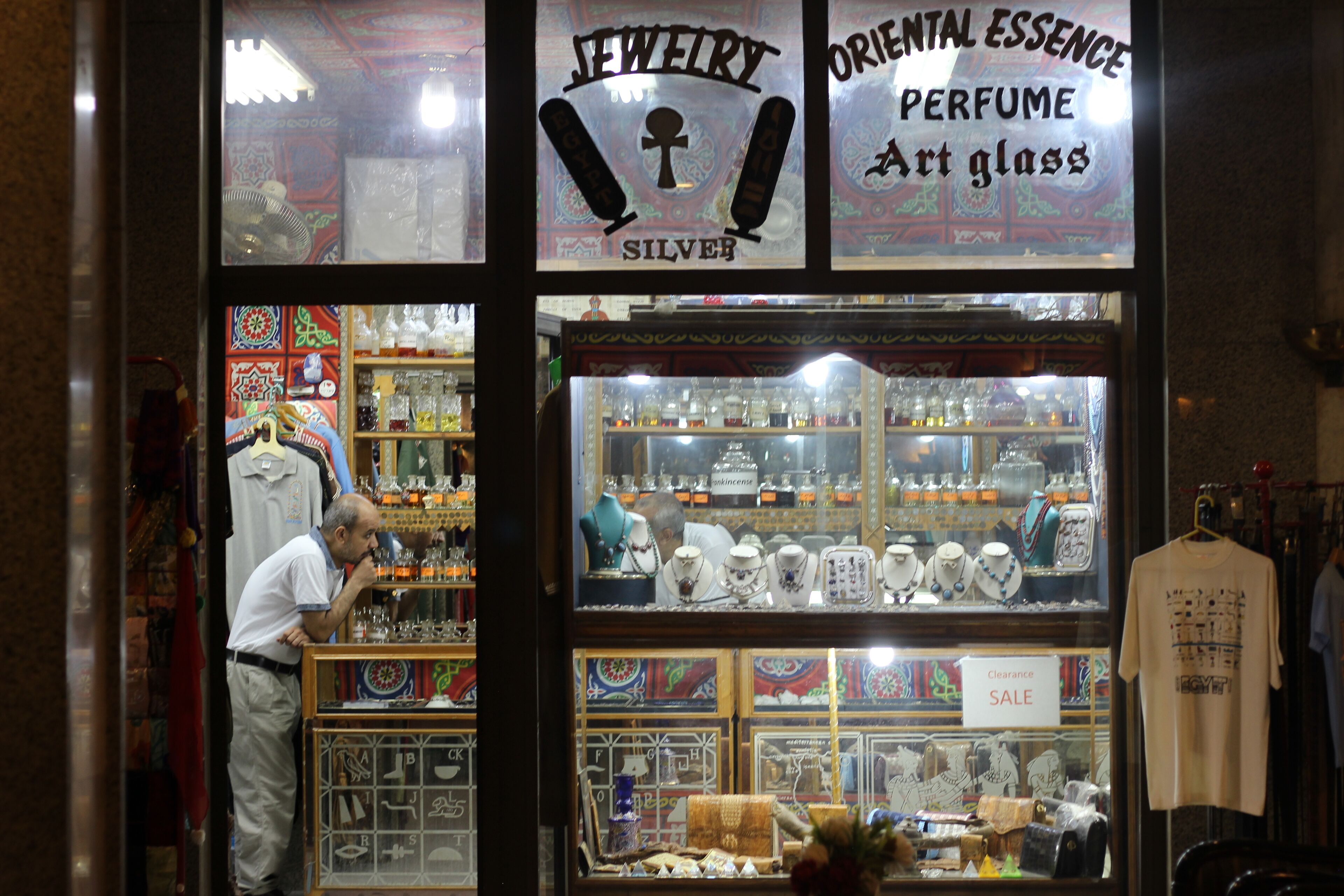A jewelry store with a variety of items on display, including silver jewelry and art glass.