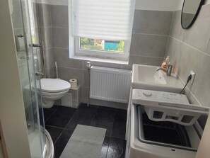 Shower, hair dryer, towels, soap