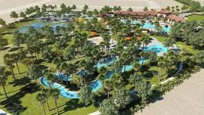 Vista aérea de un complejo turístico con varias piscinas, palmeras y edificios del complejo.