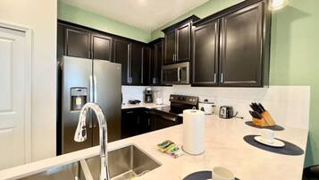 Coffee/tea maker, fridge, microwave, oven