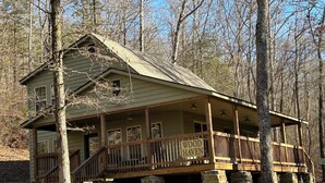 A rustic cabin with a porch, stone foundation, and a sign that reads "WOOD HAVEN". - Park and ride to the ATV trailhead and the Mulberry River at Cass Arkansas. (Ozark)