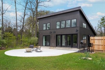 The cottage boasts a unique board and batten design.