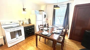 Fridge, stovetop, electric kettle, cookware/dishes/utensils