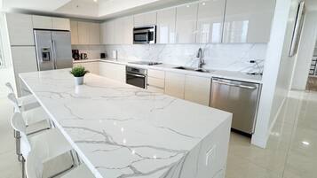 Fridge, coffee/tea maker, cookware/dishes/utensils