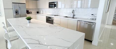 Fridge, coffee/tea maker, cookware/dishes/utensils