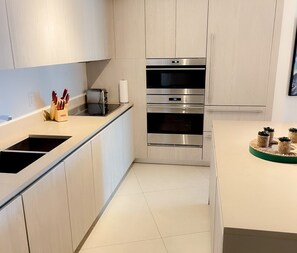 Fridge, coffee/tea maker, toaster, cookware/dishes/utensils