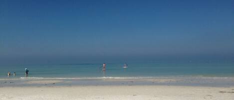 On the beach, sun-loungers, beach towels