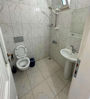 Shower, designer toiletries, hair dryer, bathrobes