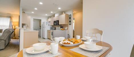 Enjoy a quiet breakfast for two at this elegant dining area with a beautifully set table.