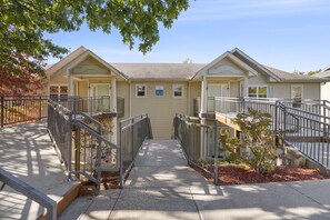 Stunning two-story building with a central entrance and covered walkway.