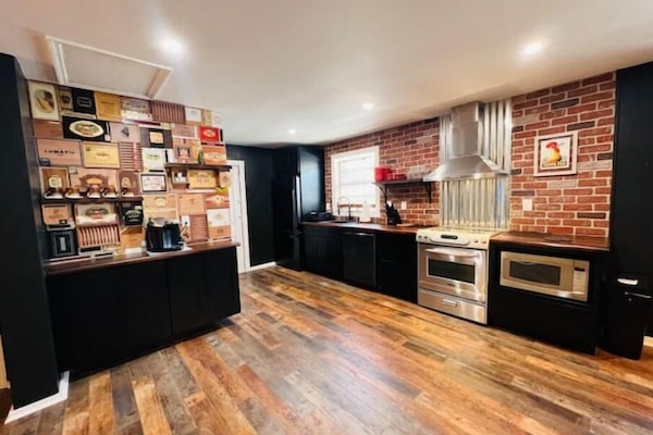 Full kitchen. Electric stove, Refrigerator, dish washer, coffee bar, microwave.