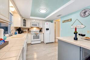 Immerse yourself in a kitchen that is not just fully equipped but is a visual delight. - Cozy Oasis Screened Pool Picturesque Water Canal Views! (Port Richey)