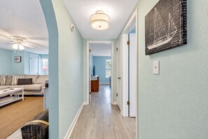 Hallway to the bedrooms. - Cozy Oasis Screened Pool Picturesque Water Canal Views! (Port Richey)