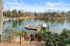 Enjoy serene lakeside views and access to the water from the dock.