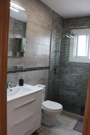 Shower, hair dryer, towels, soap