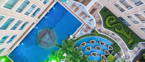 Seasonal outdoor pool, open 2:00 PM to 8:00 PM, pool umbrellas