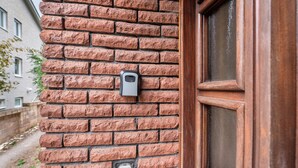 A brick wall with a door frame and a door. - "Pesch" Holiday Apartment with Shared Terrace (Nettersheim -Pesch)