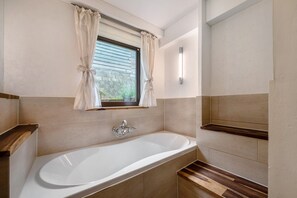 Bathtub, hair dryer, towels