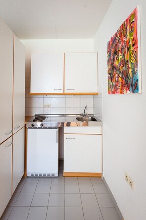 Fridge, microwave, stovetop, coffee/tea maker