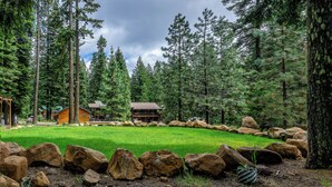 A cabin surrounded by a rock garden and dense forest. - Green Springs Inn (Ashland)
