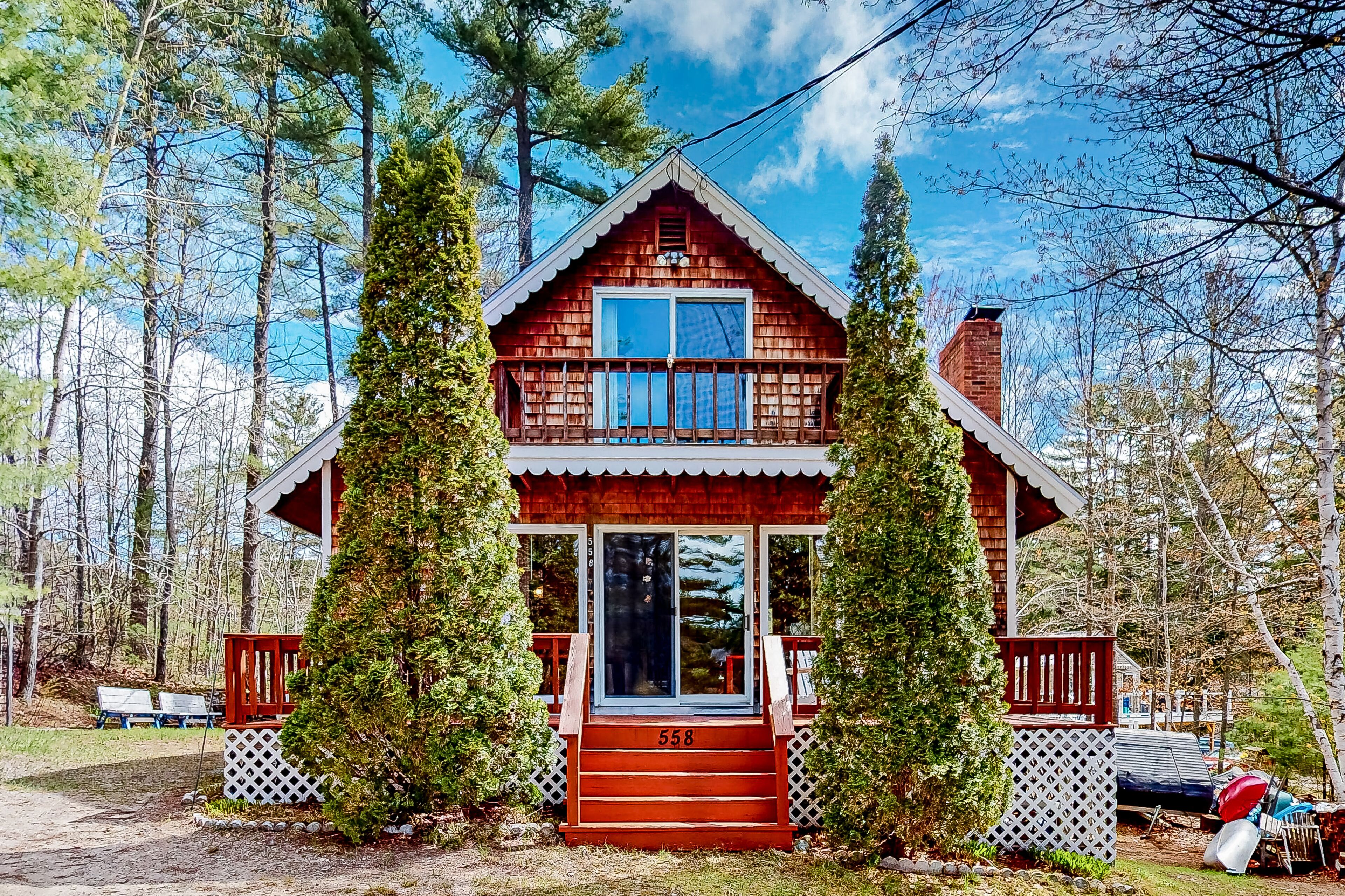 Calming dog-friendly lake view home with firepit, wood stove, patio, & gas grill