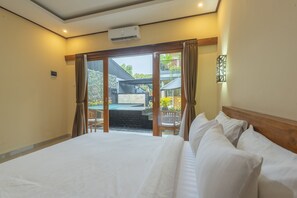 Family Package 3D2N - Triple Room | Bed sheets - Liliy Guest House Legian (Legian)