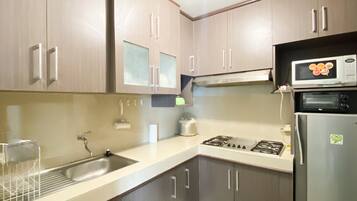 Apartment | Private kitchen | Full-size fridge, microwave, stovetop, rice cooker