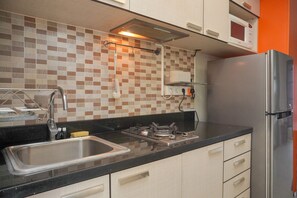 Apartment | Private kitchen | Full-size fridge, stovetop, rice cooker - Modern And Cozy Stay 1Br At Tamansari Semanggi Apartment (Jakarta)