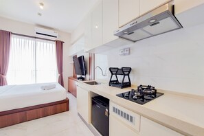 Apartment | Private kitchen | Full-size fridge, stovetop, rice cooker, cookware/dishes/utensils - Nice Design And Minimalist Studio At Sky House Bsd Apartment (Pagedangan)