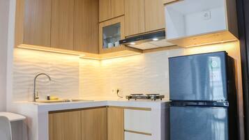 Apartment | Private kitchen | Full-sized fridge, stovetop, rice cooker, cookware/dishes/utensils