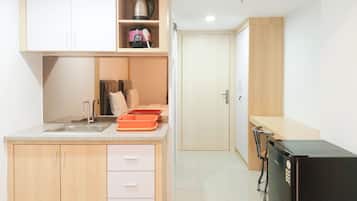 Apartment | Private kitchen | Full-sized fridge, stovetop, rice cooker, cookware/dishes/utensils