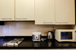 Apartment | Private kitchen - Homey And Spacious 3Br Apartment At Braga City Walk (Bandung)