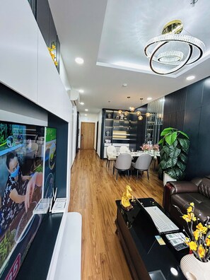 Luxury Apartment | Living area | Flat-screen TV, fireplace