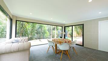 Elite Villa | Living area | 65-inch Smart TV with cable channels, TV