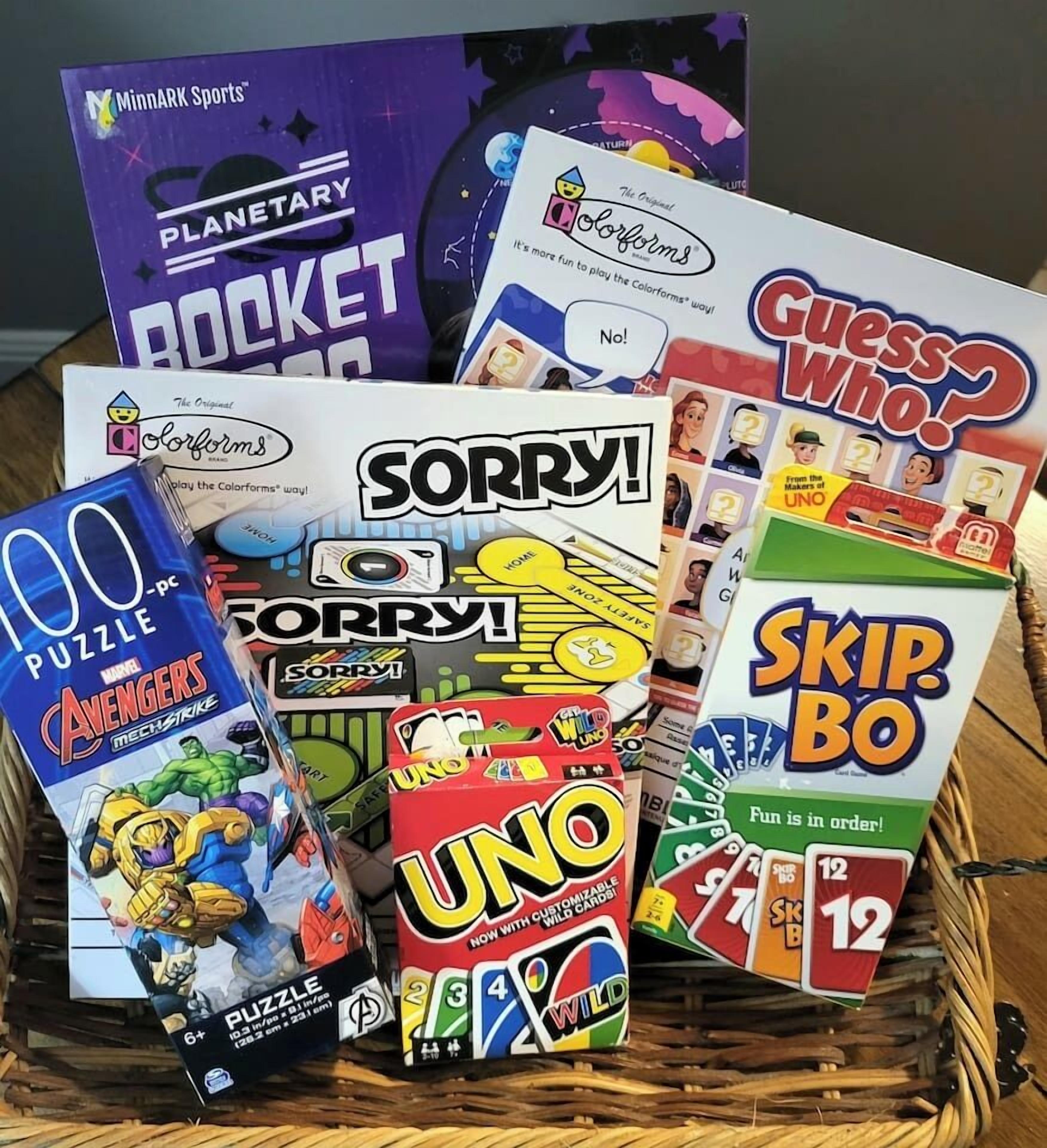 A variety of board games including Planetary Rocket, Sorry!, UNO, and Guess Who?