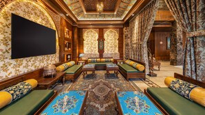 A luxurious interior with a central seating area, ornate ceiling, and patterned walls. - WelcomHeritage Grand Srinagar (Srinagar)