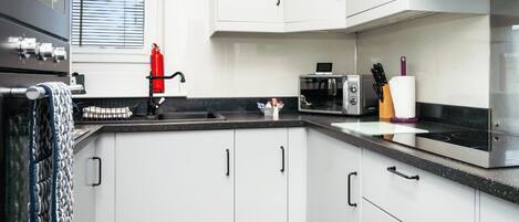 Fridge, microwave, toaster, cookware/dishes/utensils