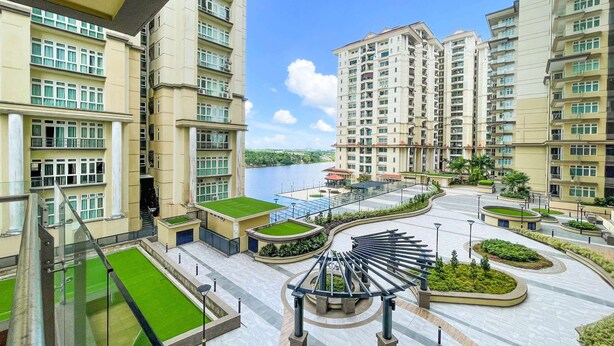 A high-rise residential building with multiple balconies, a landscaped courtyard, and a view of a river. - Kuching Riverine Resort  (Kuching)