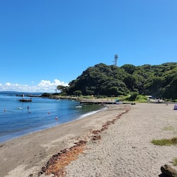 On the beach, black sand