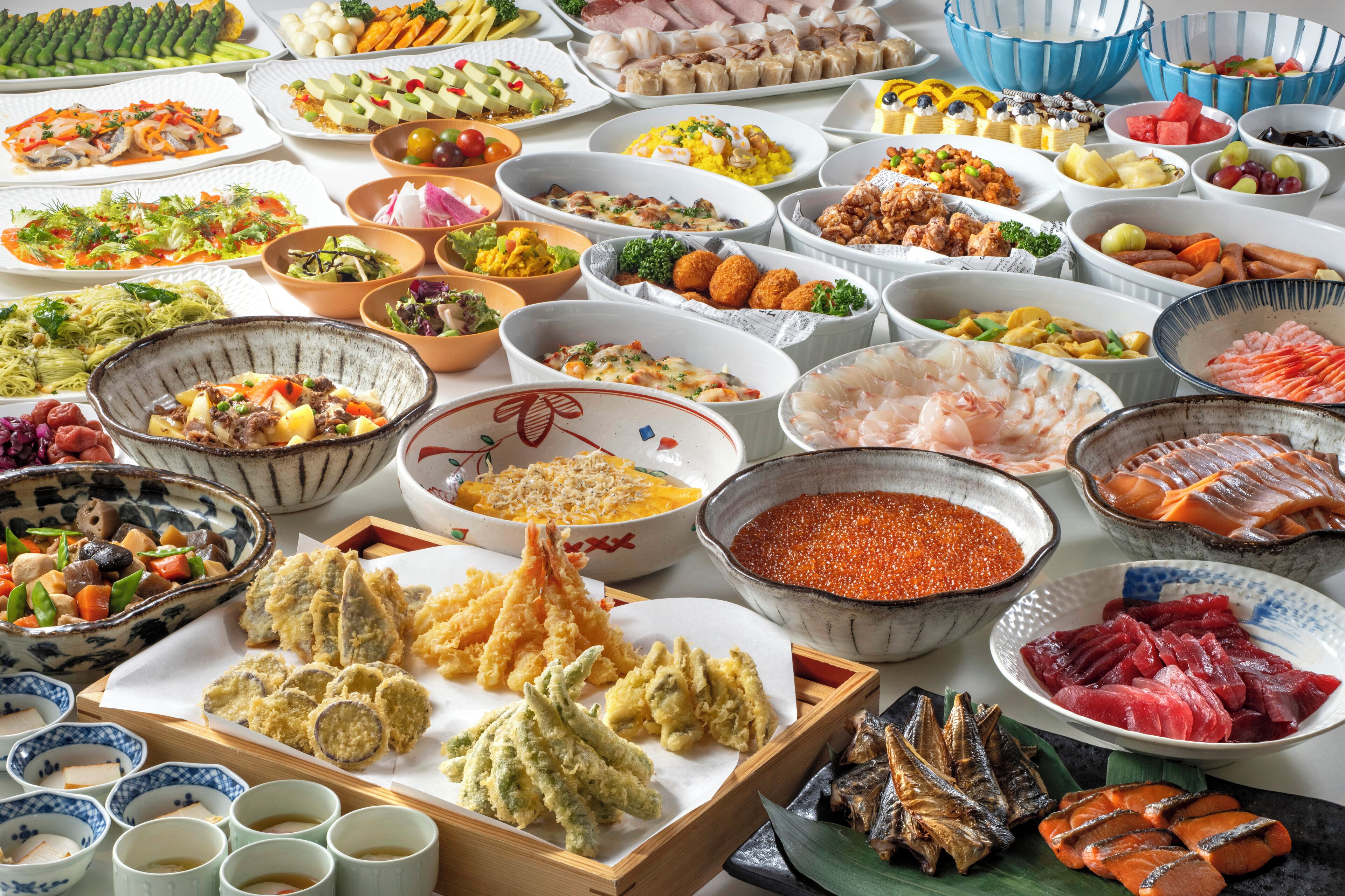 A variety of dishes and food items on a table.