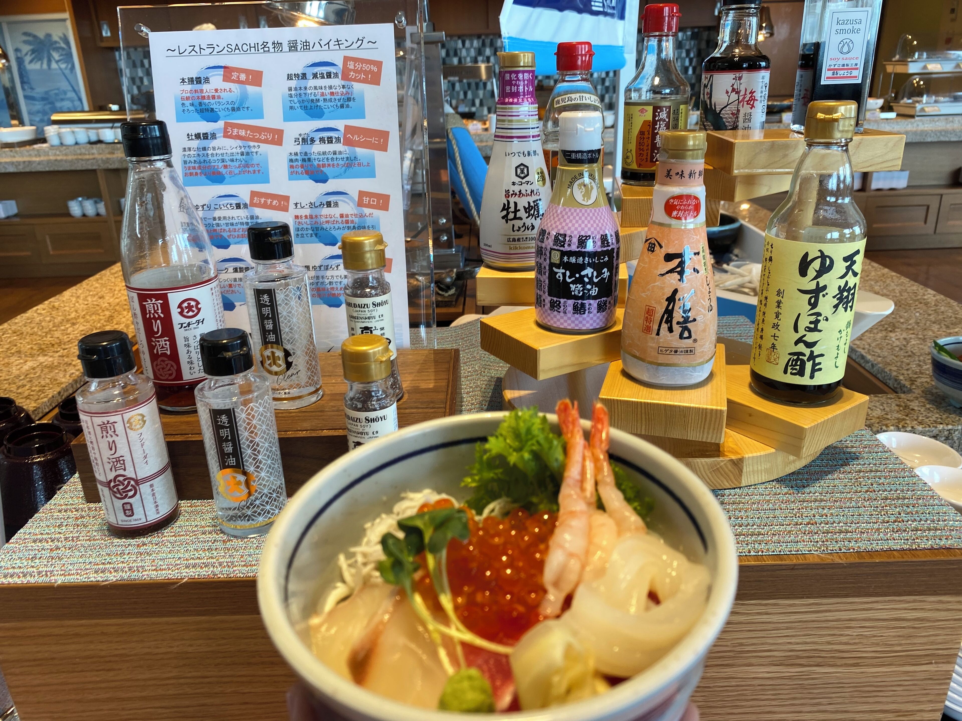 A restaurant counter with various condiments and a bowl of food.