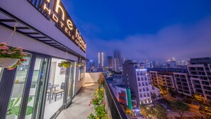 A hotel with a balcony overlooking a cityscape. - The Home Hotel & Apartment (Da Nang)