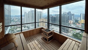 A high-rise room with large windows offering a cityscape view. - NOVO Serviced Suites by Widebed (Kuala Lumpur)