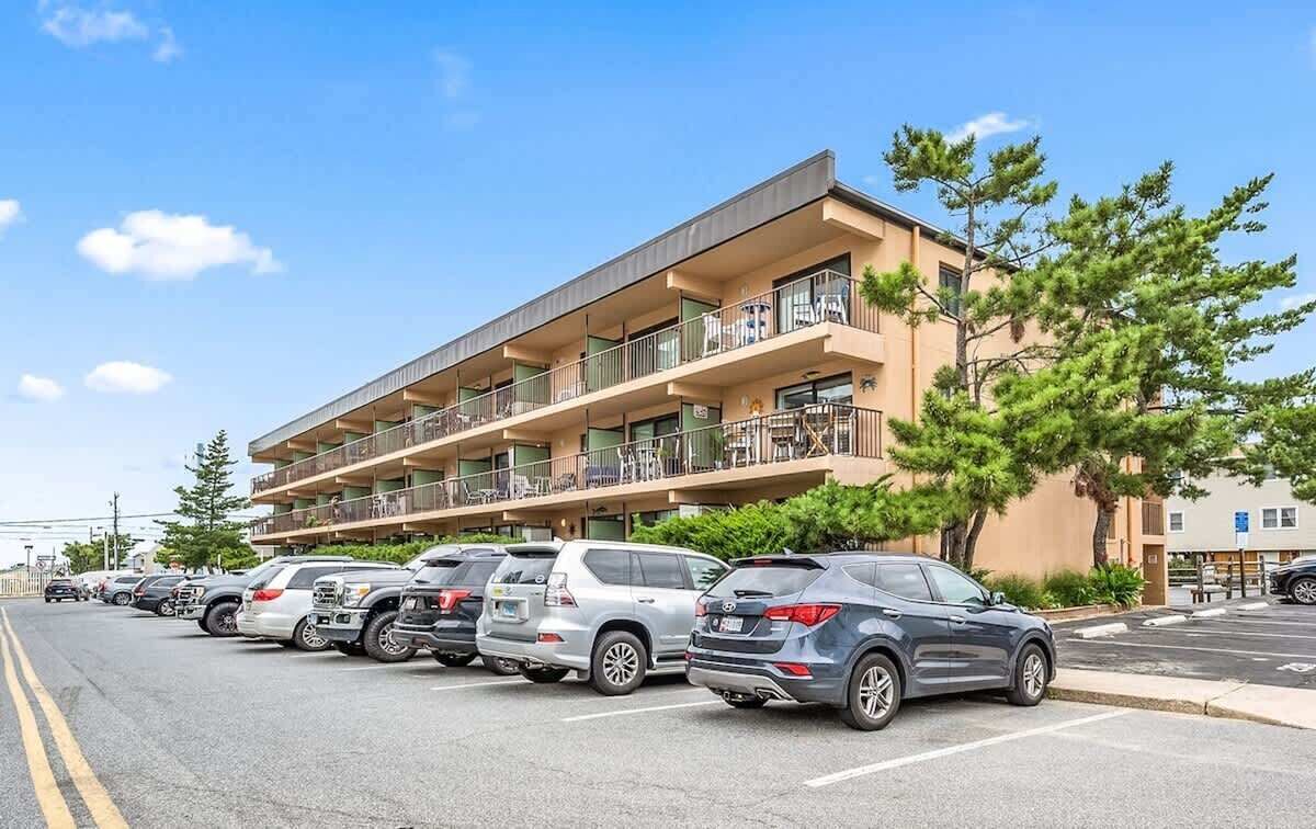 A multi-story parking garage with several cars parked.