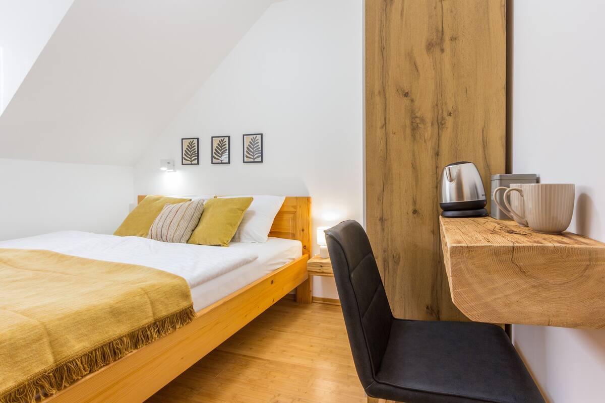 Premium bedding, desk, laptop workspace, free WiFi