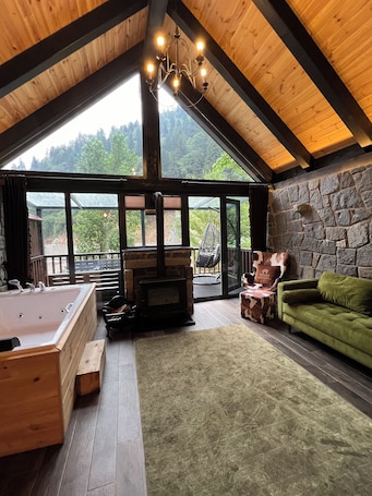Premium Chalet, 1 Double Bed, River View | Living area | 100-inch Smart TV with satellite channels, TV, fireplace